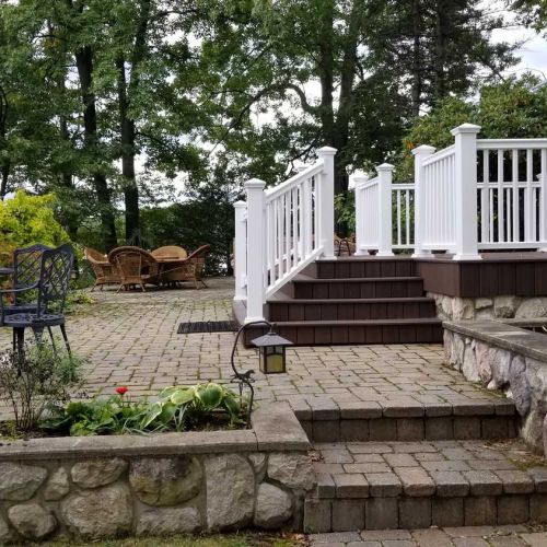 Stone patio and side of deck